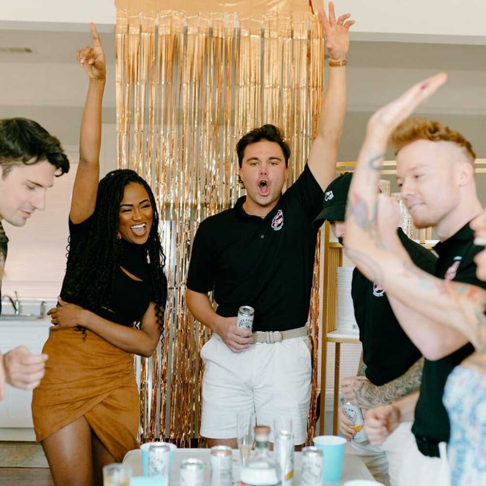 a group of people holding wine glasses