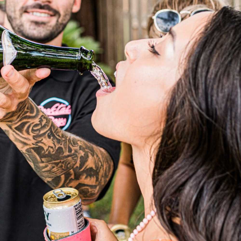 a person drinking from a glass