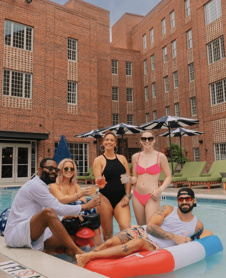 a group of people sitting in front of a building