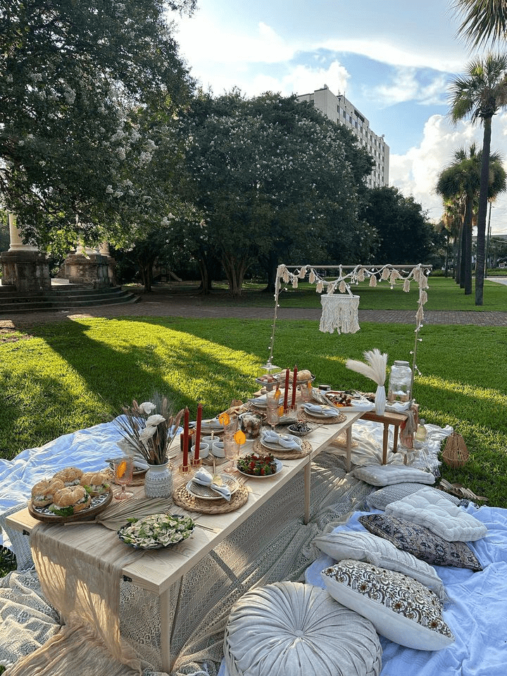 a group of people sitting at a picnic table