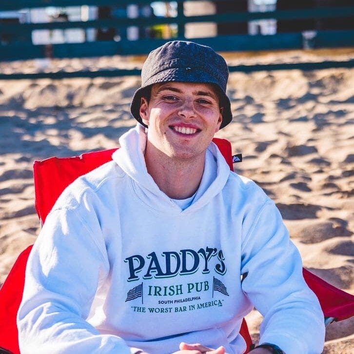 a man sitting at a beach